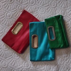 Three clutch handbags